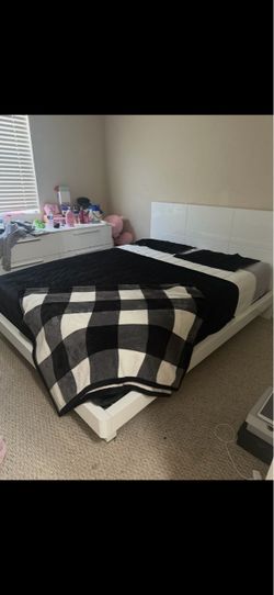 White bed frame and dresser