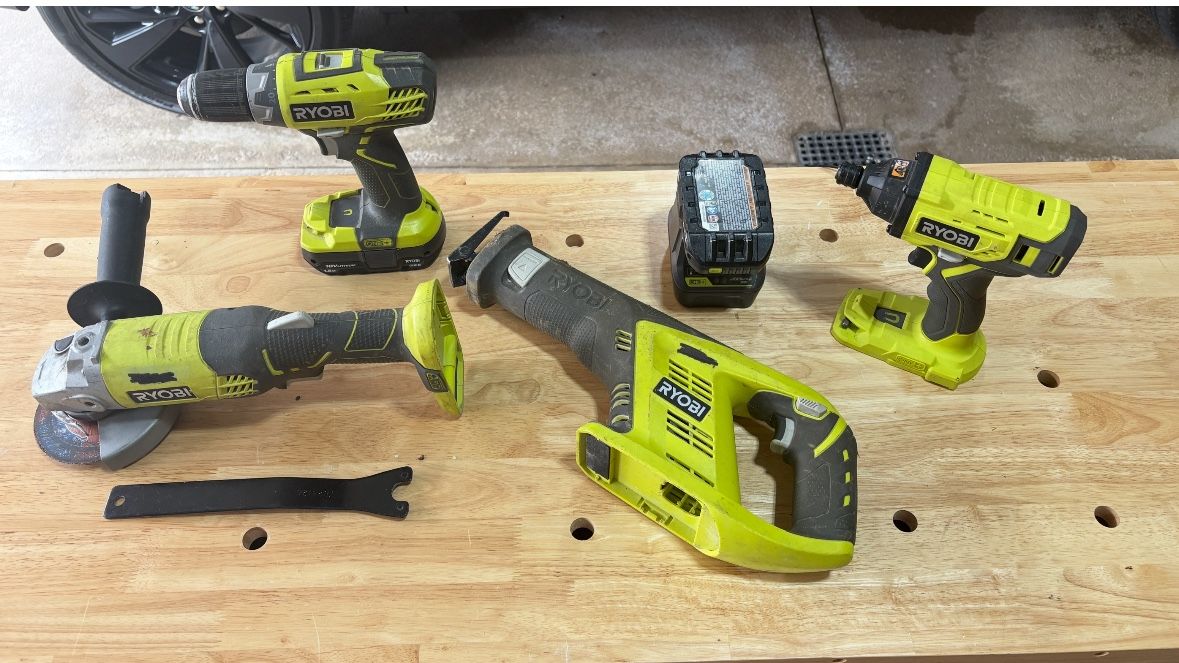 Ryobi 18 volt tool set. Drill, impact gun, reciprocating saw and angle grinder Charger 2 batteries