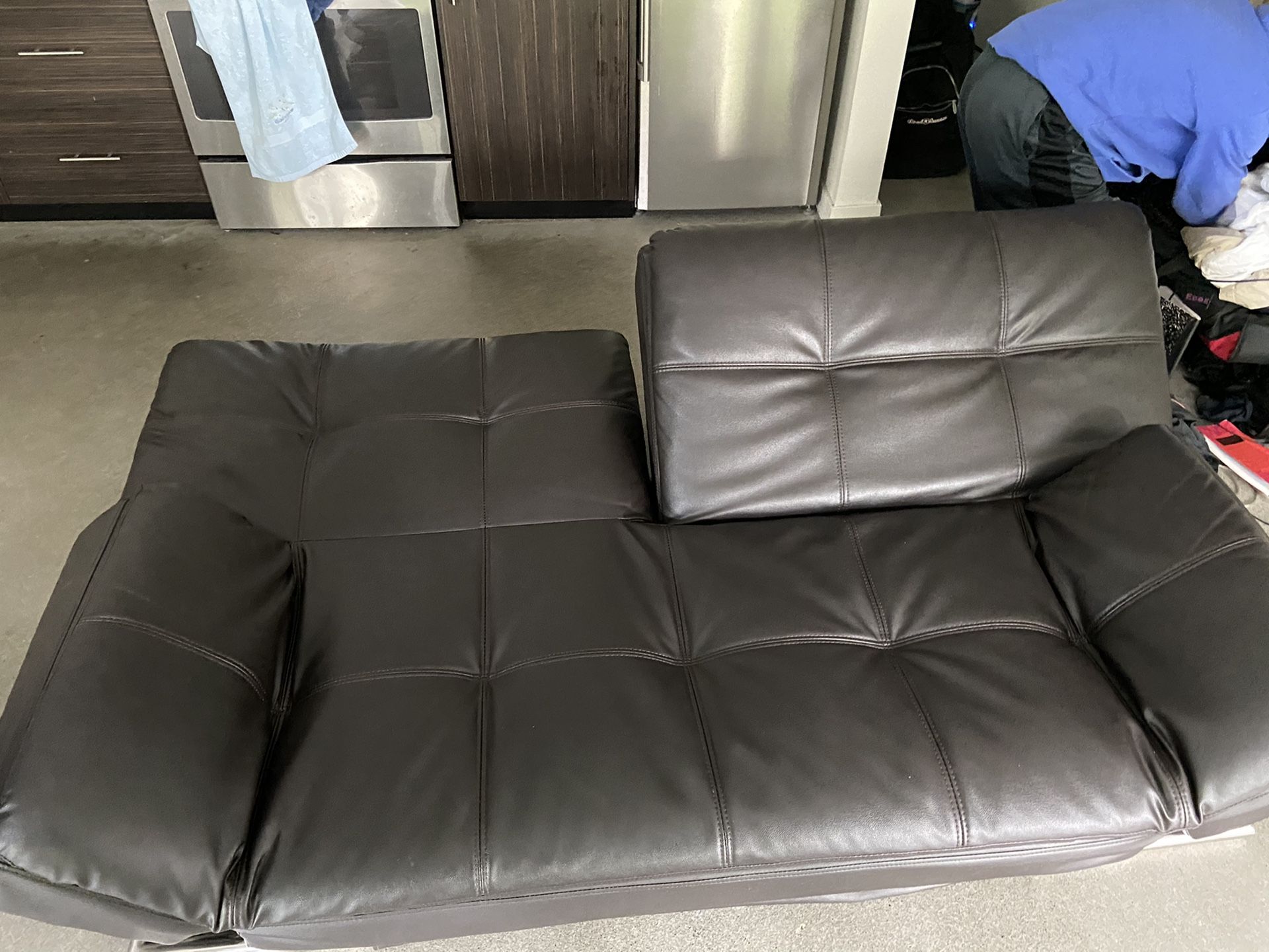 Selling a black, leather FUTON sofa!