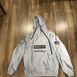 Members Only Space Suit Silver Reflective Pullover Jacket featuring NASA-inspired patches. 