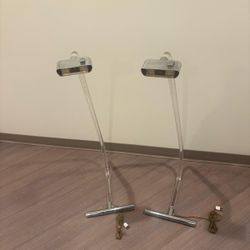 This is a pair of "Crylicord" lucite and chrome floor lamps by Peter Hamburger for Knoll.