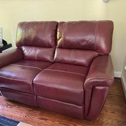 Burgundy / wine red leather love seat sofa