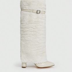Cream faux fur knee high boots with buckle detail