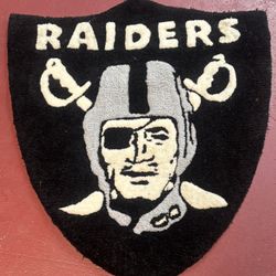 custom-made tufted rug or patch featuring the Las Vegas Raiders logo.  