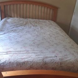 Queen 4 piece bedroom set. Queen bed frame, 2 dressers, large mirror all in good condition