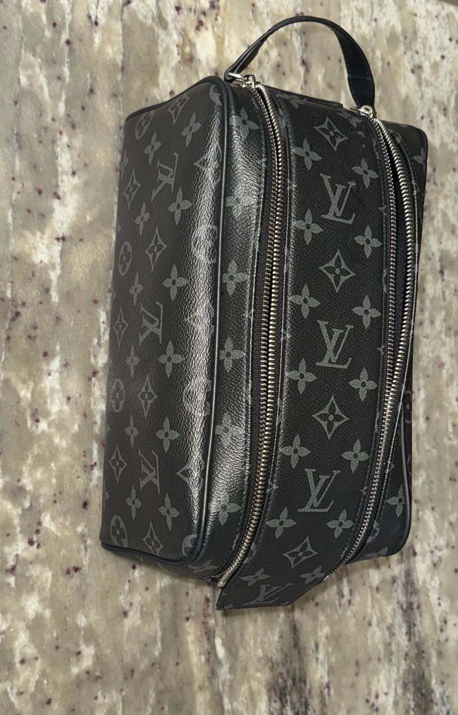 Louis Vuitton’s ultra-practical Dopp Kit Monogram Eclipse canvas