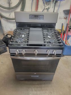 Nearly new GE gas stove.
