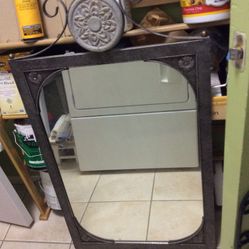Mirror metal frame dark sliver accent with stone deco on the top 22” wide x 32” high - with top deco 38-1/2” high