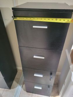 4 drawer wood file cabinet. 2 bottom drawers with lock