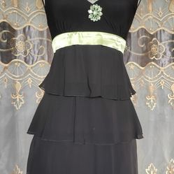 stylish black halter-neck dress with a tiered and ruffled skirt.  Size s