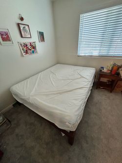 Mattress and wooden bed frame