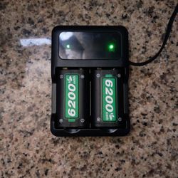 High-Capacity Rechargeable Batteries (Lithium 1.5v)  And The Charger Willing To Negotiate 