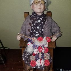 Ceramic grandma sitting in a rocking chair figurine
