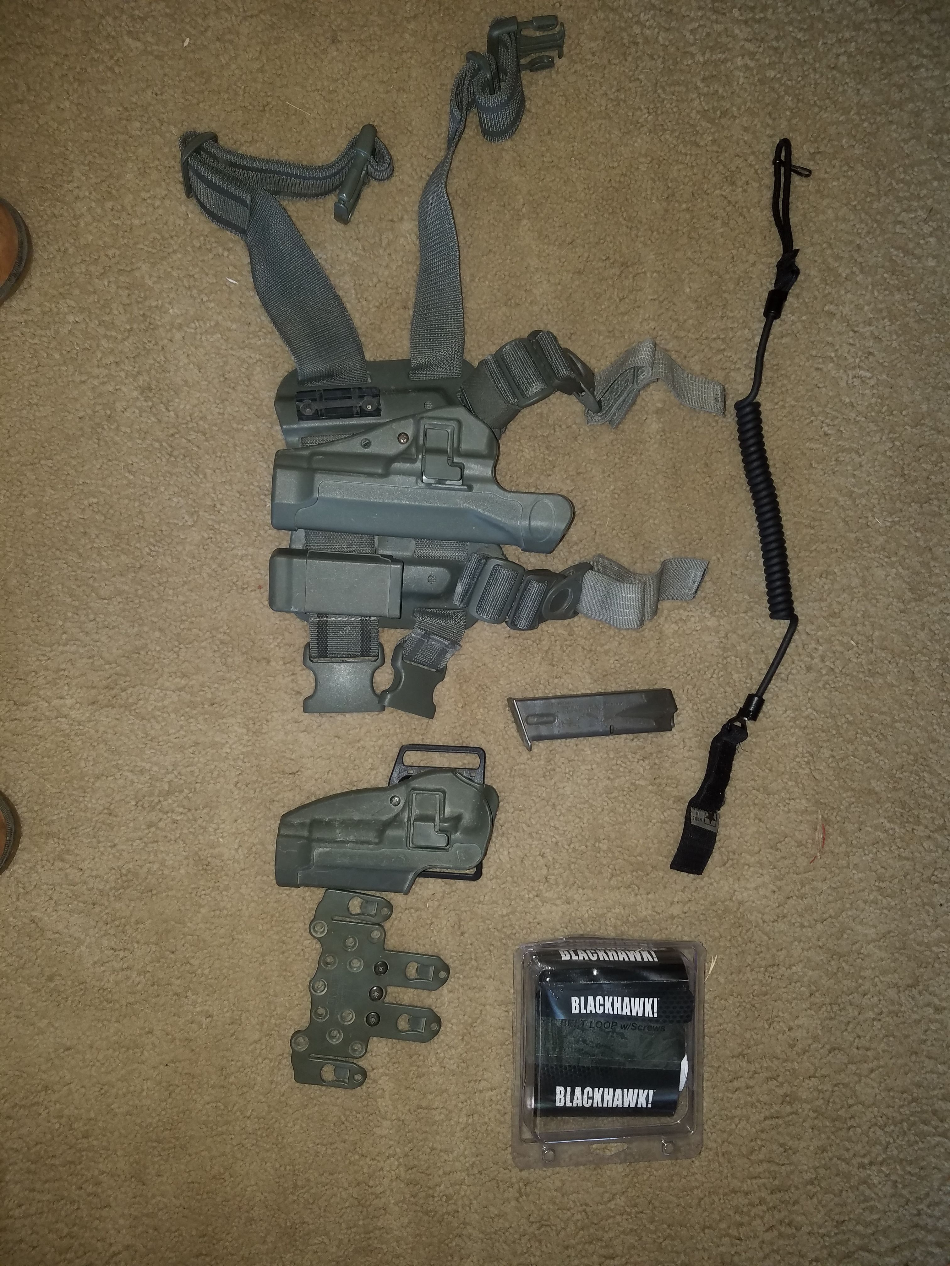 Drop leg, MOLLE, and hip holster for Army Beretta M9. With lanyard.