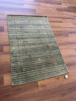 Green handmade wool gabbeh rug
