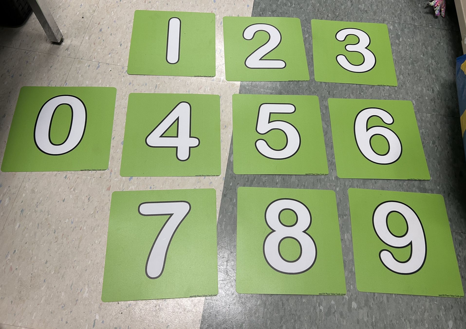 Green and white large plastic number cards 