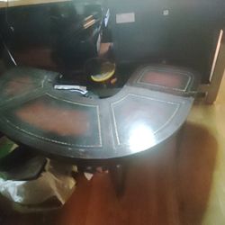 Antique horseshoe table with leather inlays