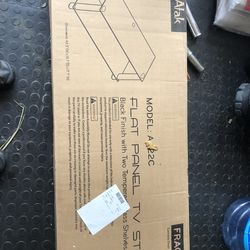 Brand new in the box TV stand with Glass shelves