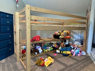 Twin platform bed with shelves.