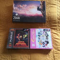 3 Sealed Puzzles: 2 Game Stop Exclusives 550 Pieces 18”x24” Super Metroid & Sailor Moon Also The Legend Of Zelda Breath Of The Wild 1000 Piece Puzzle