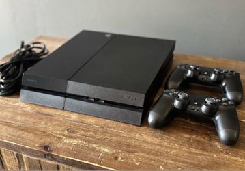 Sony PlayStation 4 Console with Two Controllers