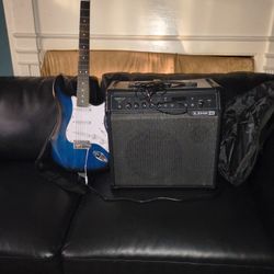Combo Amp and Electric Guitar with cord and Different Size Picks 