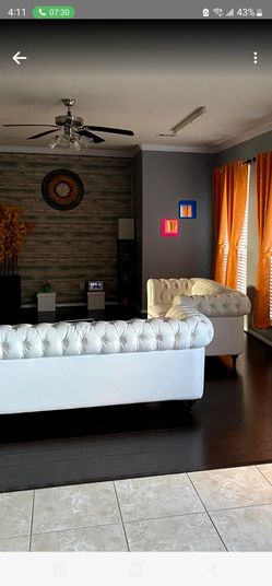 White sofas tufted