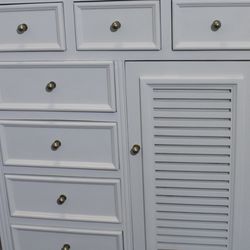 An Off White Tall Chest Of Drawers