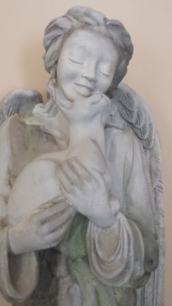 Angel Sculpture surrounded by cats