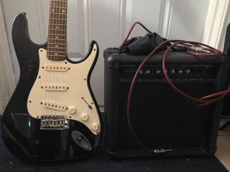 Peavey electric guitar with amp