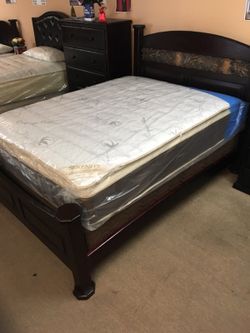 Queen bed with pillow top mattress