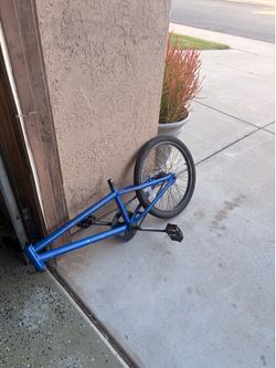 Bmx frame with rear tire, cranks, and chain