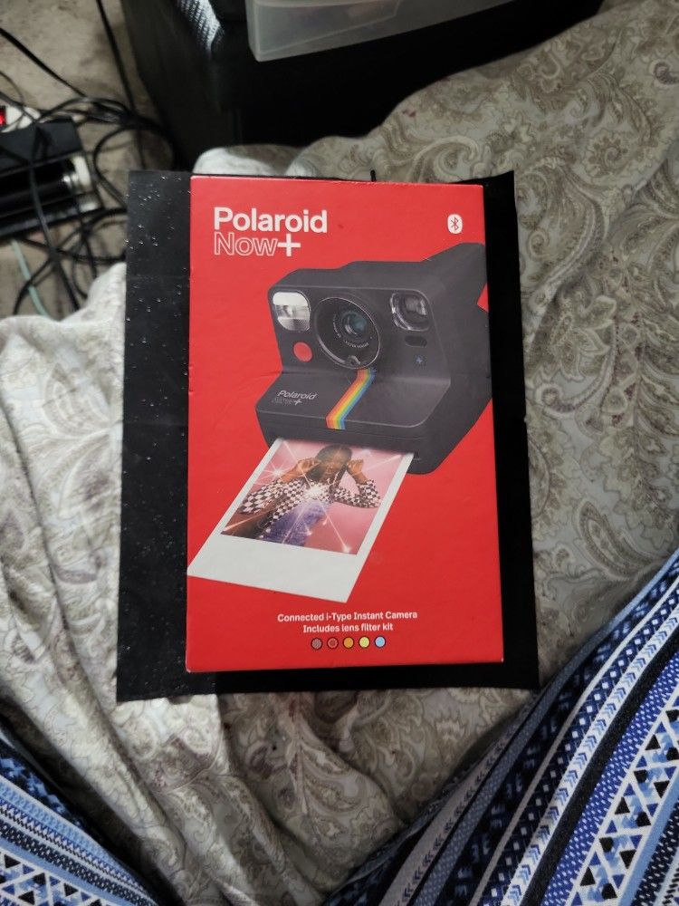 Polaroid now plus instant camera includes lens filter kit. It includes Bluetooth to connect with a mobile app.