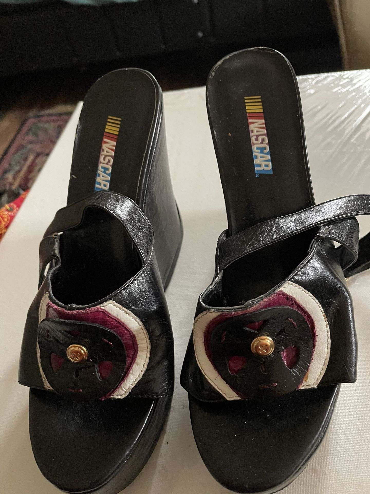 - [ ] Vintage Nascar Wedges. High heels. Leather look. Race track attire. Racing Old shoes.