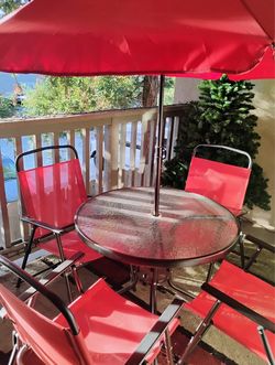 Red Patio Table Set with Umbrella and Chairs