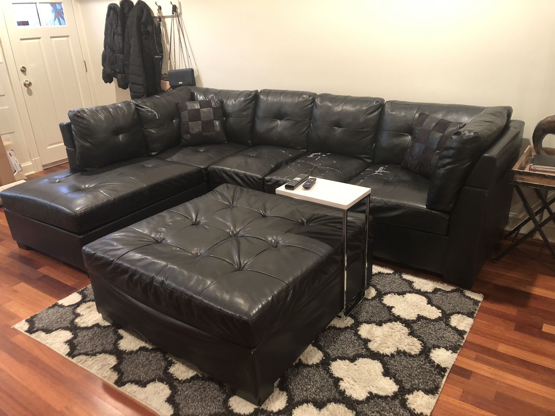 Black Leather Sectional Couch and Ottoman