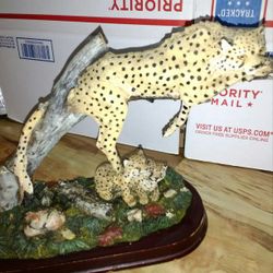 Mother jaguar and 2 cubs in jungle setting statue