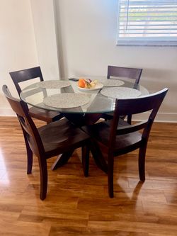 Round glass table with 4 chairs