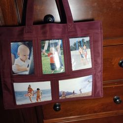 BURGUNDY TOTE BAG WITH PLASTIC PHOTO  CUT  OUTS  FOR CHILDRENS PHOTOS.  $20.