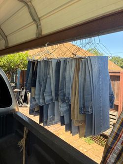 30 men’s jeans & 25 shirts $200
