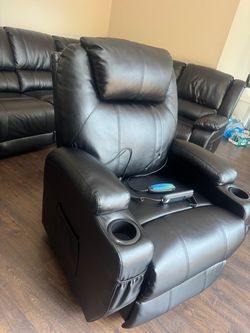 Comfortable reclining chair with vibration massage and heating function.