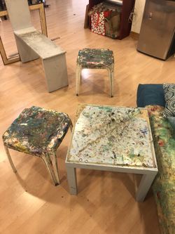 Stools side tables with some paint on them