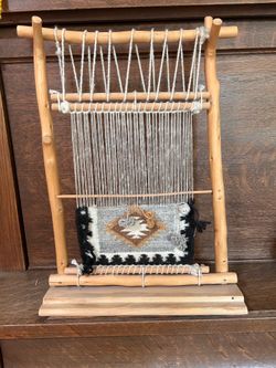Vintage 1975 decor replica of a Navajo loom and rug.
