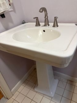 Waterworks pedestal sink with faucets