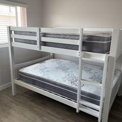 Full over Full bunk bed. Dark walnut,grey & white-$499. Full mattresses -$125.00 each. Assembly not included. Taxes included. Free delivery.  Se habla