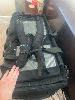 Military roller bag also has shoulder straps