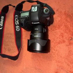 CASH ONLY The Canon EOS 6D is a compact and lightweight (755 g) full-frame DSLR. It comes with two tripods, a small flashlight, a carrying case, and t