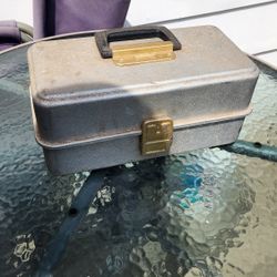 Vintage UMCO 173AS aluminum 3-tray fishing tackle box, 
filled with various fishing accessories. 
