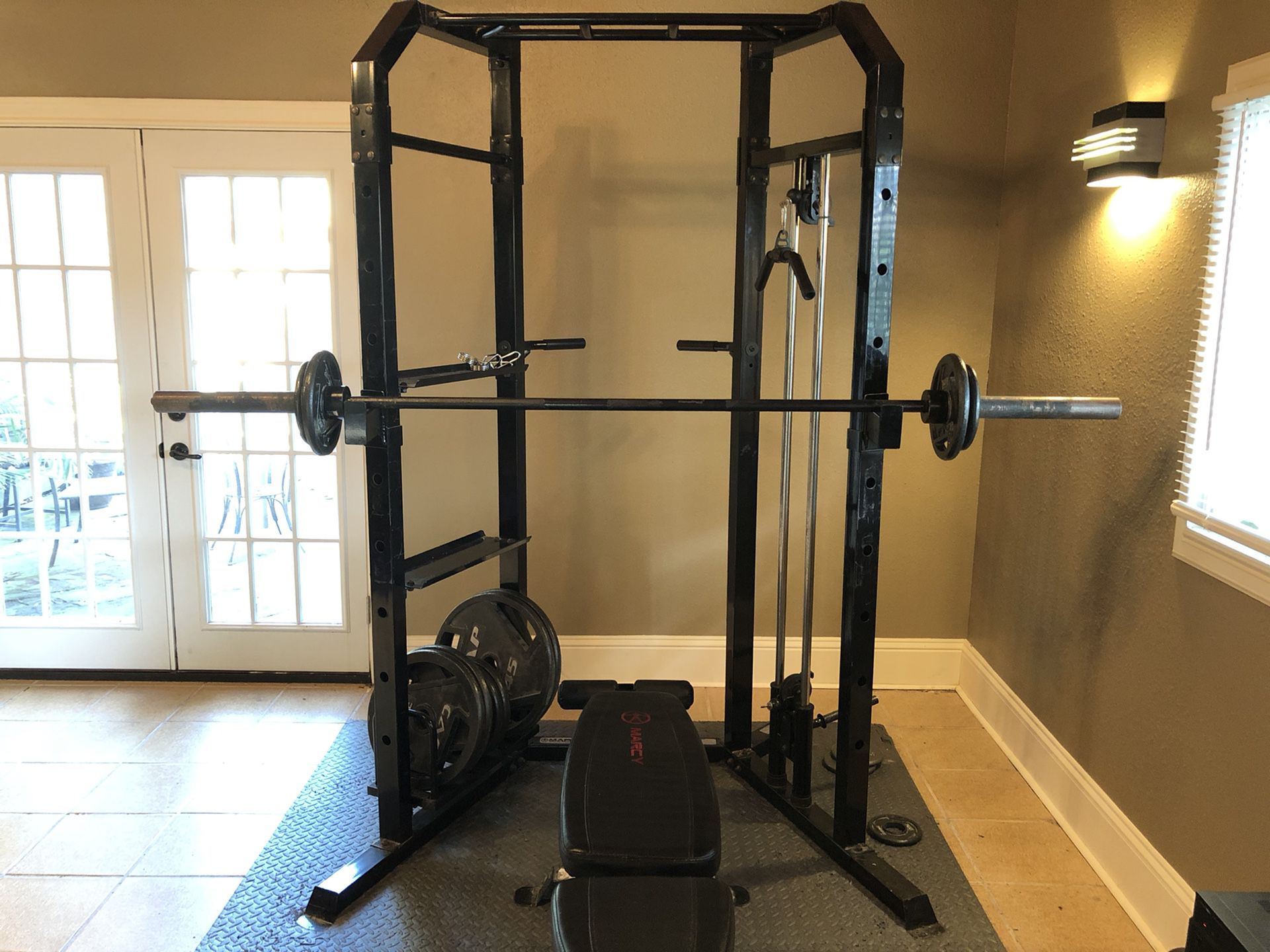 Home gym cage with weights, bench and floor