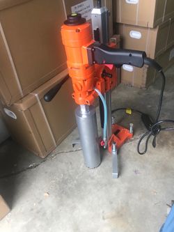 Concrete hand held drill with a detachable stand able to drill holes from 11/2 to 4 1/2 inch price $495